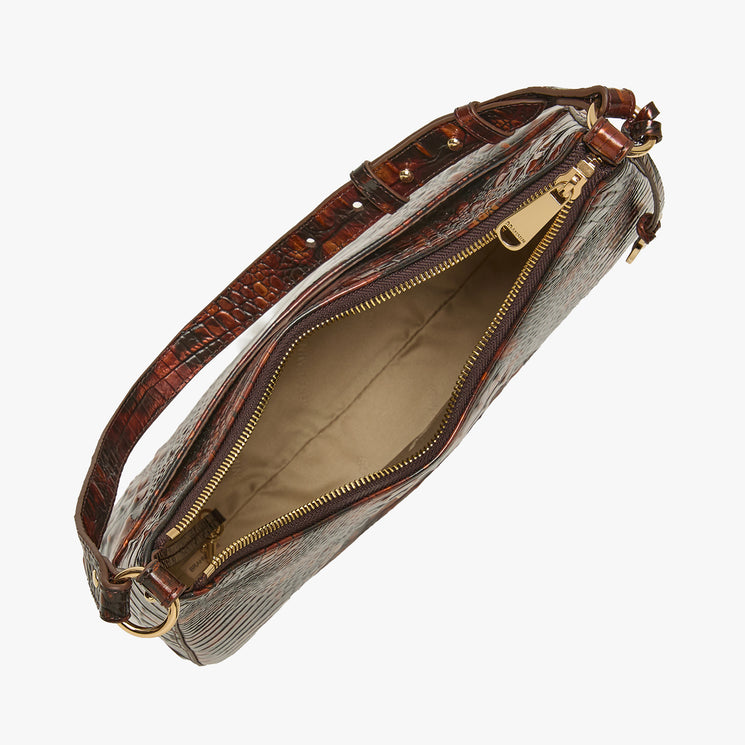 Top view of an open Brahmin brown textured leather handbag with gold-tone zipper, beige fabric lining, spacious main compartment, and interior zip pocket visible; elegant structured silhouette ideal for shoulder wear.
