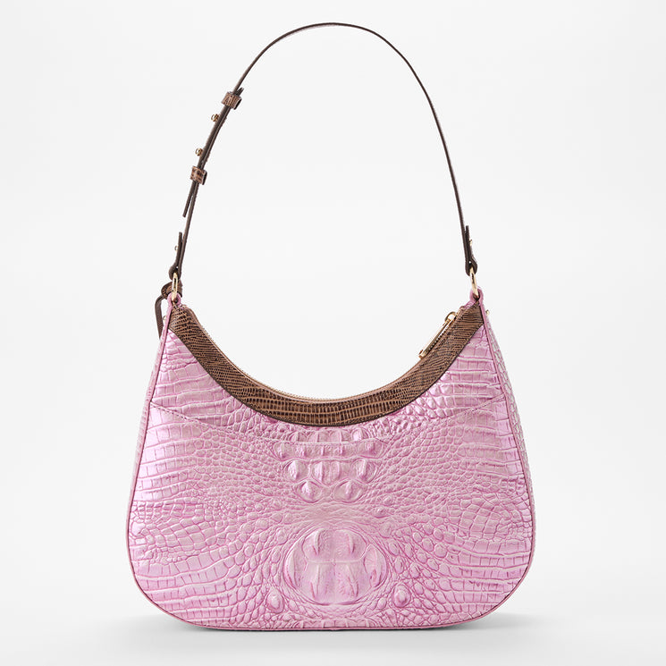 Brahmin pink embossed leather handbag with a brown adjustable shoulder strap, curved top silhouette, and textured pattern. Set on a white background, showing exterior details and modern shape.