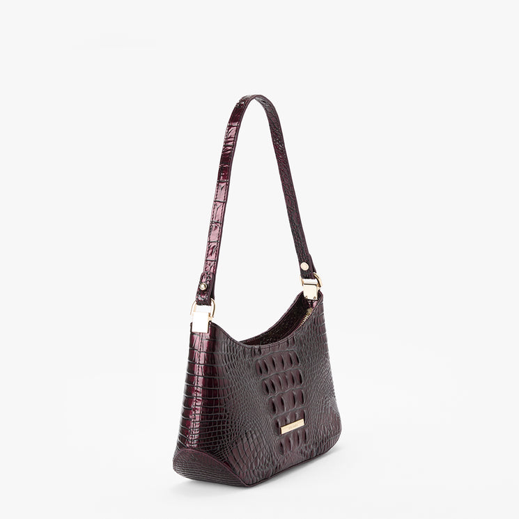 A dark burgundy crocodile-embossed shoulder bag with gold-tone hardware, shown from a three-quarter angle against a plain white background.