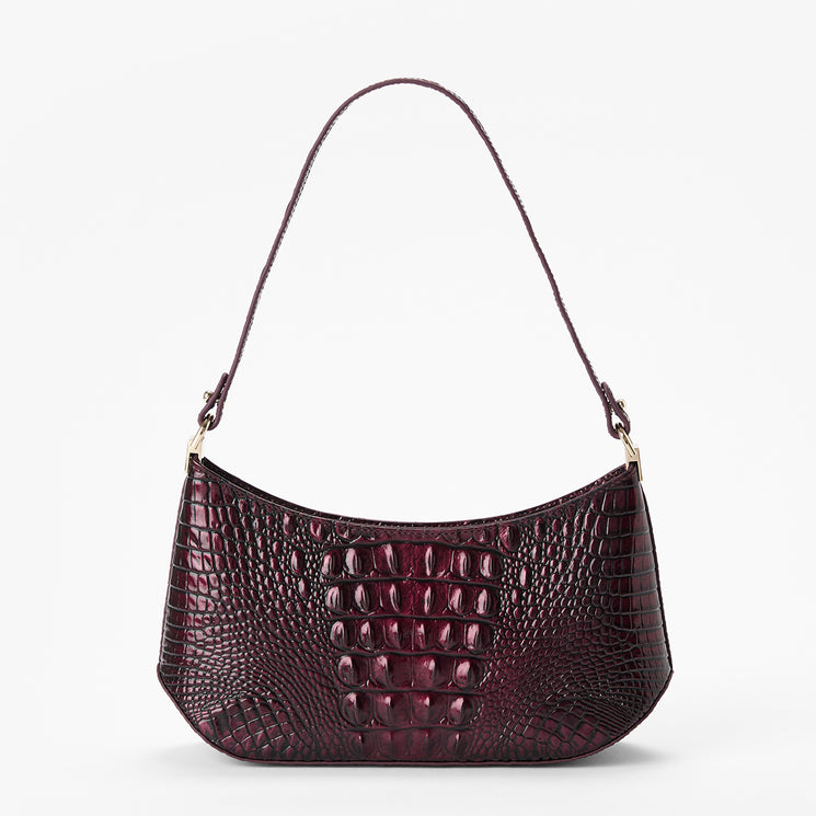 A crescent-shaped shoulder bag with a glossy embossed crocodile pattern in deep burgundy, featuring a matching shoulder strap and gold-tone hardware, set against a plain white background.