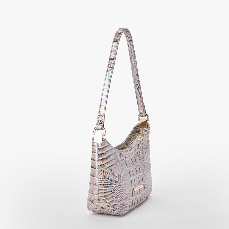 Brahmin small iridescent shoulder bag with embossed pattern, gold-tone hardware, short strap, minimalist silhouette; shown on a plain white background.