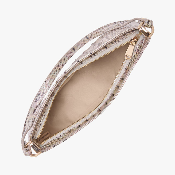 Top view of an open Brahmin handbag with a light, embossed texture, beige interior, gold-tone zipper hardware, and structured shape. The inside is empty and neatly lined for an organized look.