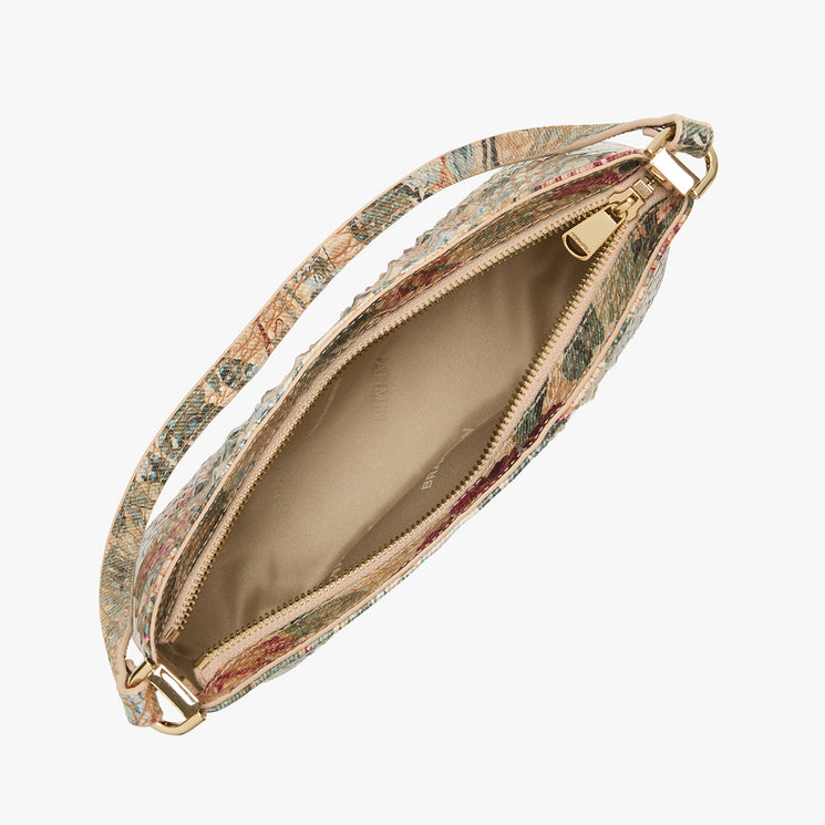 A top-down view of a small zippered clutch bag with a multicolor floral pattern exterior, a beige interior lining, and gold-tone hardware, shown on a light gray background.