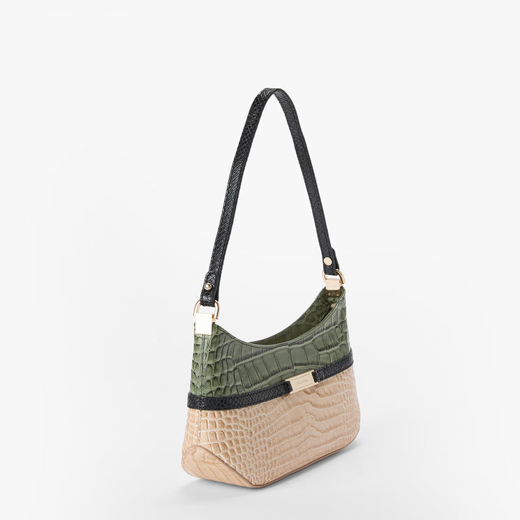 A shoulder bag with a textured crocodile skin pattern, featuring a beige lower section, an olive green upper section, a black strap, and gold-tone hardware, shown against a plain white background.