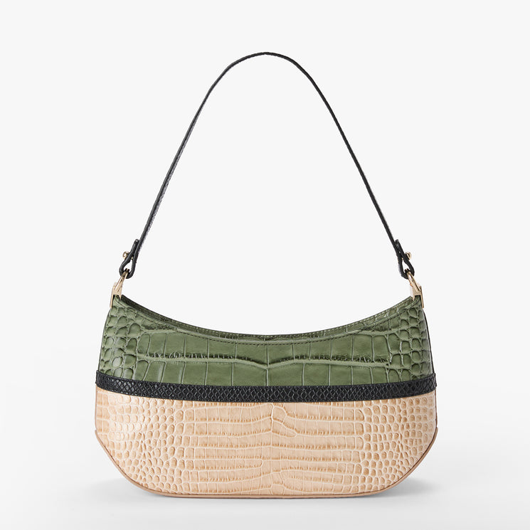 A crescent-shaped shoulder bag with a split design, featuring an olive green crocodile-embossed top half and a beige reptile-embossed bottom half, separated by a black textured band. It has a thin black shoulder strap and is photographed against a plain white background.