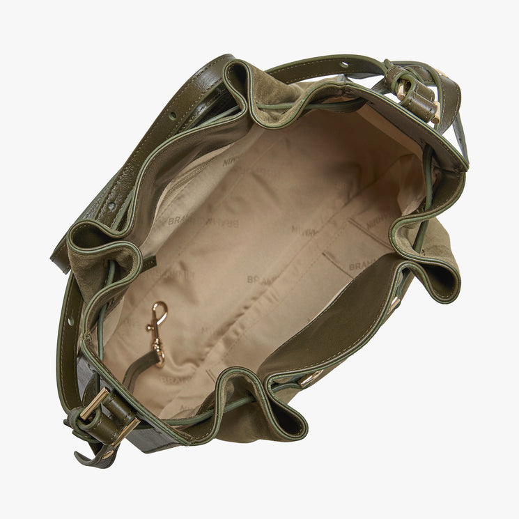 An olive green bucket bag shown from an overhead angle, highlighting its ruffled edges, beige interior lining, and gold-tone hardware against a plain white background.