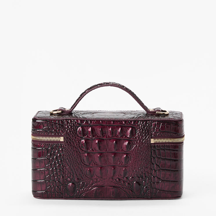 A structured rectangular handbag with a crocodile-embossed texture in deep burgundy, featuring a top handle and gold-tone zippers on the front, photographed against a plain white background.