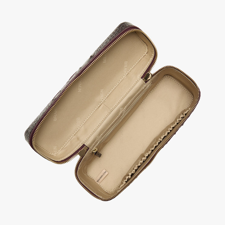 An open rectangular zippered handbag case with a dark brown embossed pattern exterior and a beige interior, shown on a light gray background.