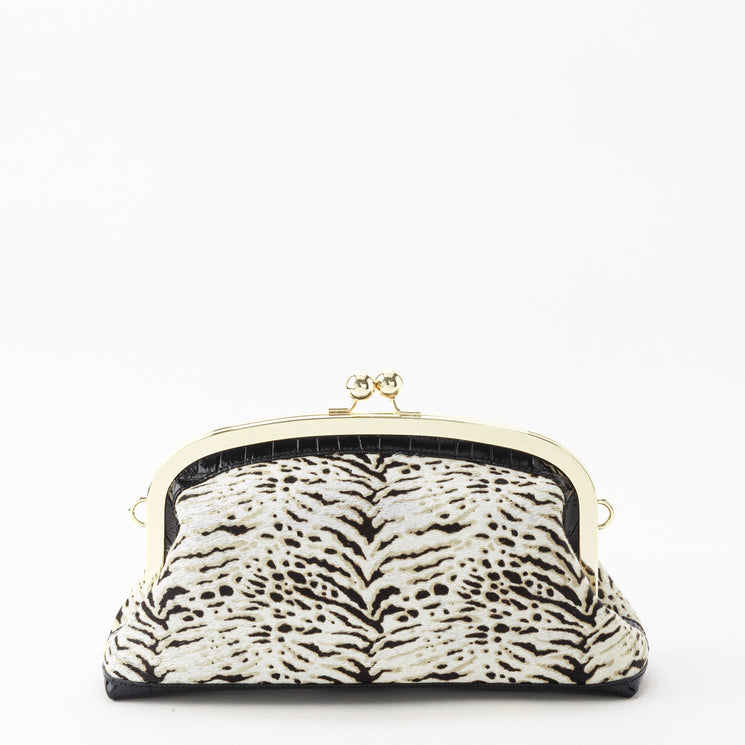 Brahmin Christine clutch in a black and white textured pattern, featuring a vintage-inspired kiss-lock closure and gold-tone metal frame.