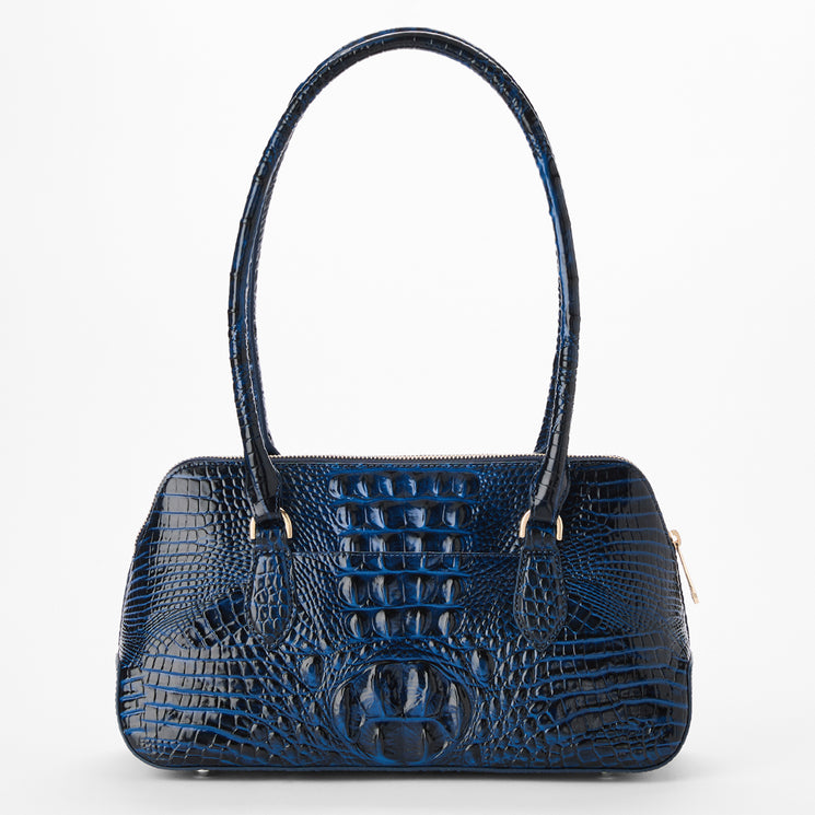 A dark blue crocodile-embossed leather handbag with a structured dome shape, double top handles, and gold-tone hardware, shown against a plain white background. Back view.