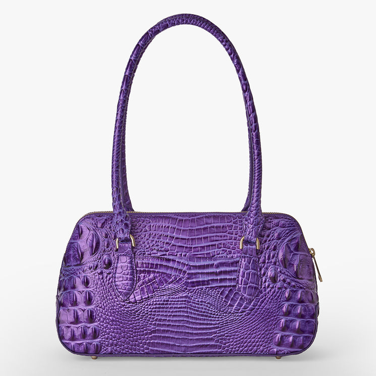 Brahmin purple satchel handbag with crocodile-embossed texture, rectangular silhouette, dual top handles, zipper closure, and silver hardware, shown on a white background.