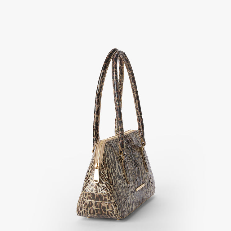 Jennifer handbag with leopard print pattern on a white background. Side view.