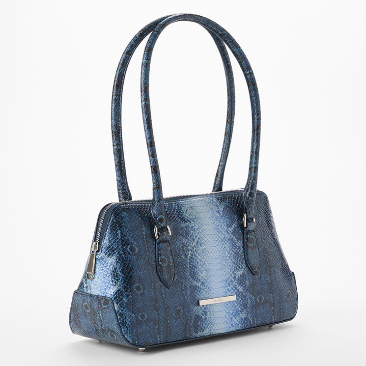 Jennifer blue textured handbag on a white background. Side view.