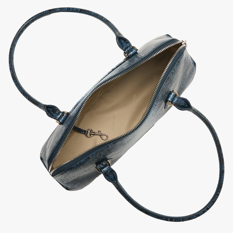 Jennifer blue handbag with a strap on a white background. Open top view.
