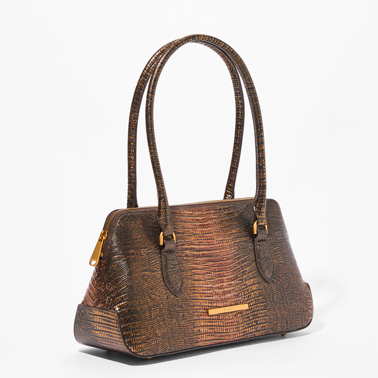 A structured handbag with a metallic bronze and brown textured faux-snakeskin pattern, featuring dual top handles, gold-tone hardware, and a zippered top closure, shown on a plain white background.