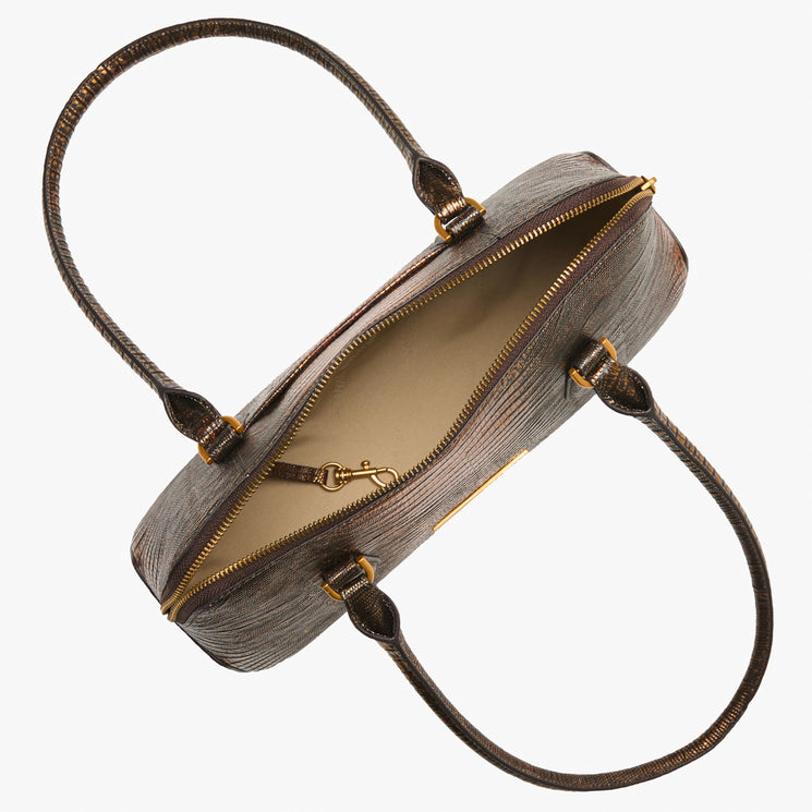 An open top view of a textured brown leather handbag with gold-tone hardware, showing the interior lining and handles against a plain white background.