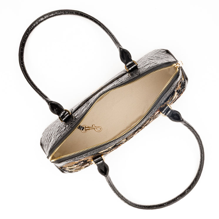 Top view of Brahmin Jennifer satchel in black textured leather, featuring two handles, beige interior, gold zipper closure, and small gold clasp detail. Bag is open and displayed against a white background.