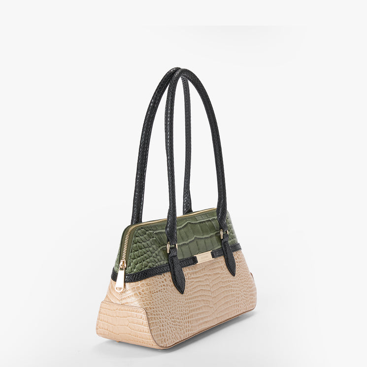 A structured handbag with a beige crocodile-embossed lower body, an olive green faux-croc textured top panel, and black shoulder straps with gold-tone hardware, shown on a light gray background.