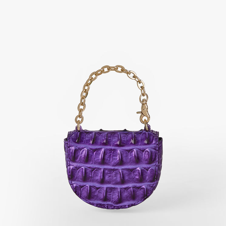 Brahmin small purple handbag with textured embossed pattern, gold chunky chain top handle, structured silhouette, and visible exterior details, displayed against a plain white background.