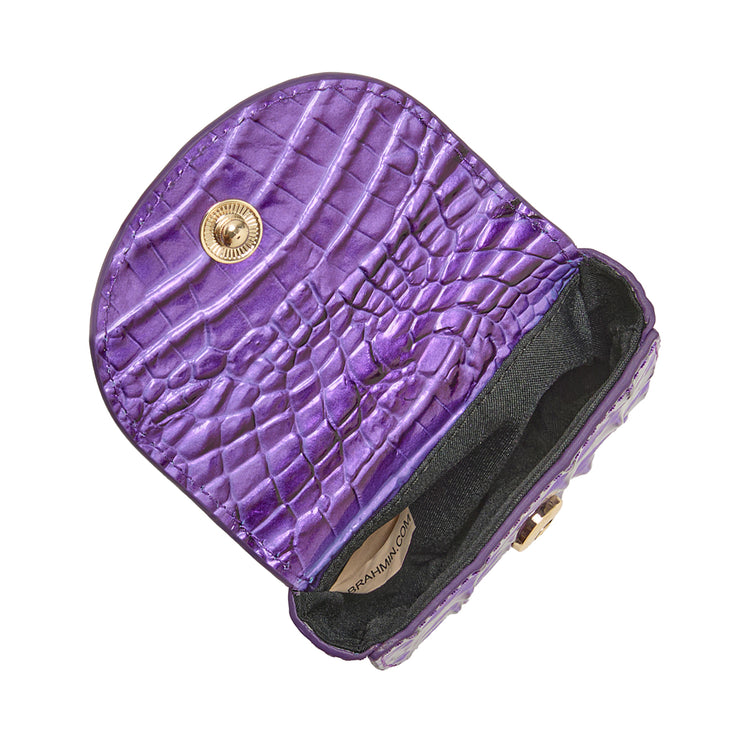 Brahmin purple coin purse featuring a small, open silhouette with embossed textured pattern, gold button clasp, and visible black fabric lining. Compact accessory for coins or small essentials.