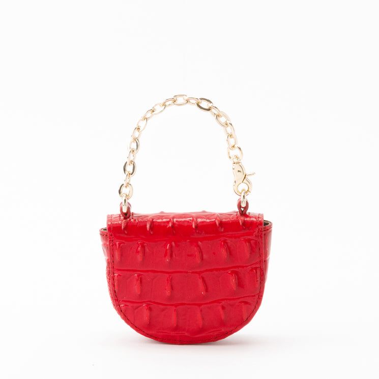 Brahmin Joy Pouch in holiday red with a curved-bottom silhouette, croc-embossed texture, and a gold-tone chain handle.