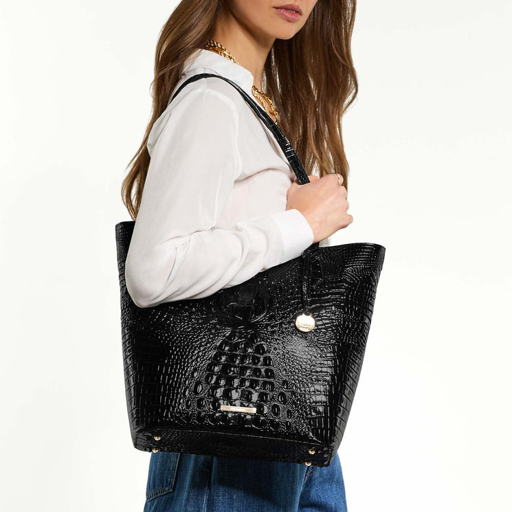 Laurel tote bag held by a person on a white background