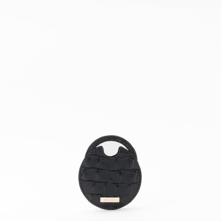 BRAHMIN small round black quilted travel pouch set featuring a short top handle, metallic brand tag on the front, and signature stitching, displayed against a plain white background.