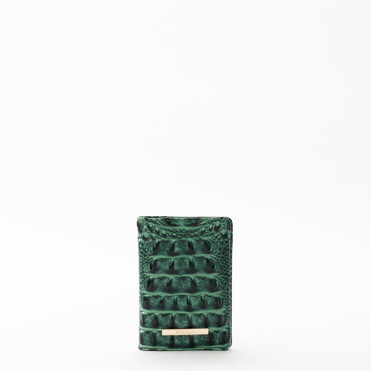 Green embossed BRAHMIN travel pouch set featuring a gold logo plate.