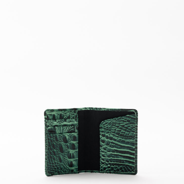 Open BRAHMIN Travel Pouch Set in green with a textured pattern.