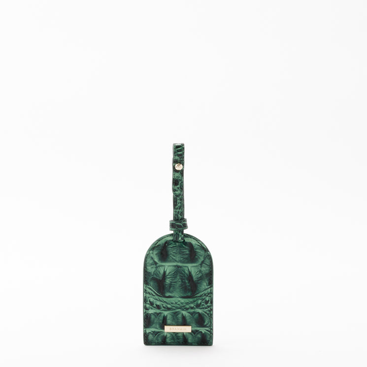 Green Brahmin Travel Pouch Set luggage tag featuring an embossed texture.