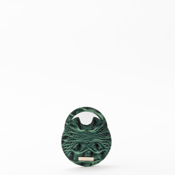 Circular Brahmin Travel Pouch Set coin purse in a dark green hue with an embossed texture.