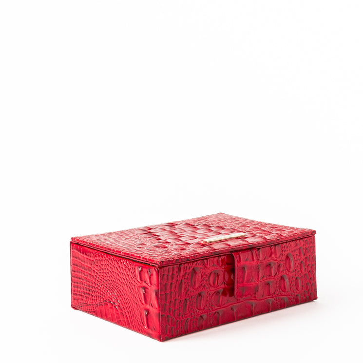 BRAHMIN Small Box in red with croc-embossed textured leather, structured silhouette, metallic clasp closure on top, and compact shape. Features a luxe finish and is shown closed from an angled view.