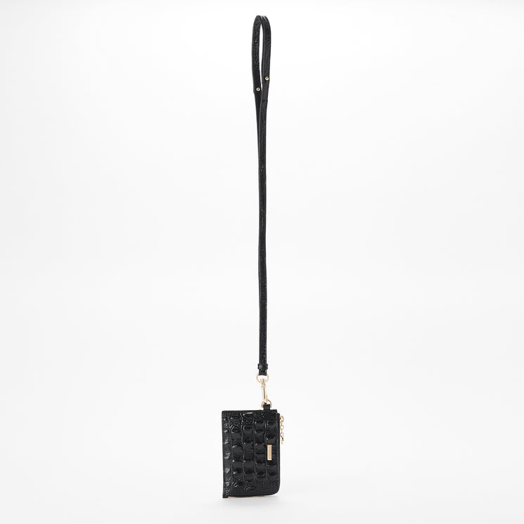 A black croc-embossed leather crossbody pouch with a long black strap and gold-tone hardware, shown against a plain white background. Front view with strap.