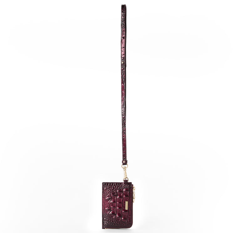 A dark burgundy crocodile-embossed leather crossbody wallet with a matching long strap and gold-tone hardware, shown against a plain white background.