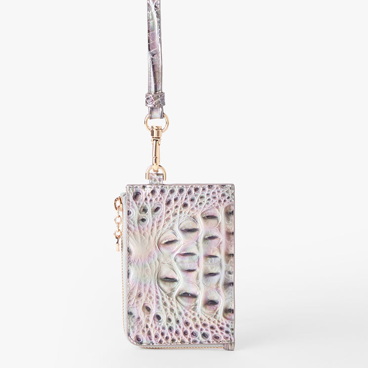 Brahmin iridescent clutch with a pastel pearlescent finish, embossed textured pattern, gold-tone zipper, detachable wrist strap, and compact rectangular silhouette shown from front with hardware details visible.