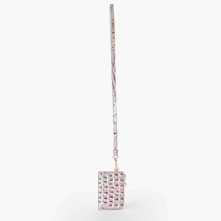 Brahmin iridescent crossbody bag with a long, thin strap, embossed crocodile-inspired texture, structured silhouette, metallic hardware, and smooth edges, displayed upright on a plain white background.