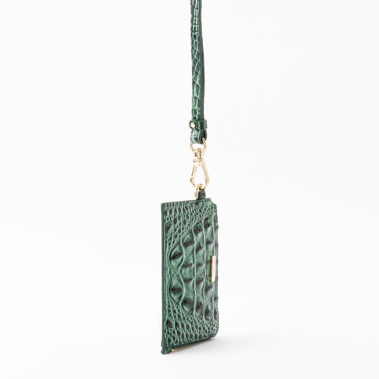 Brahmin Esther card holder in green with an embossed textured pattern on a matching lanyard strap.