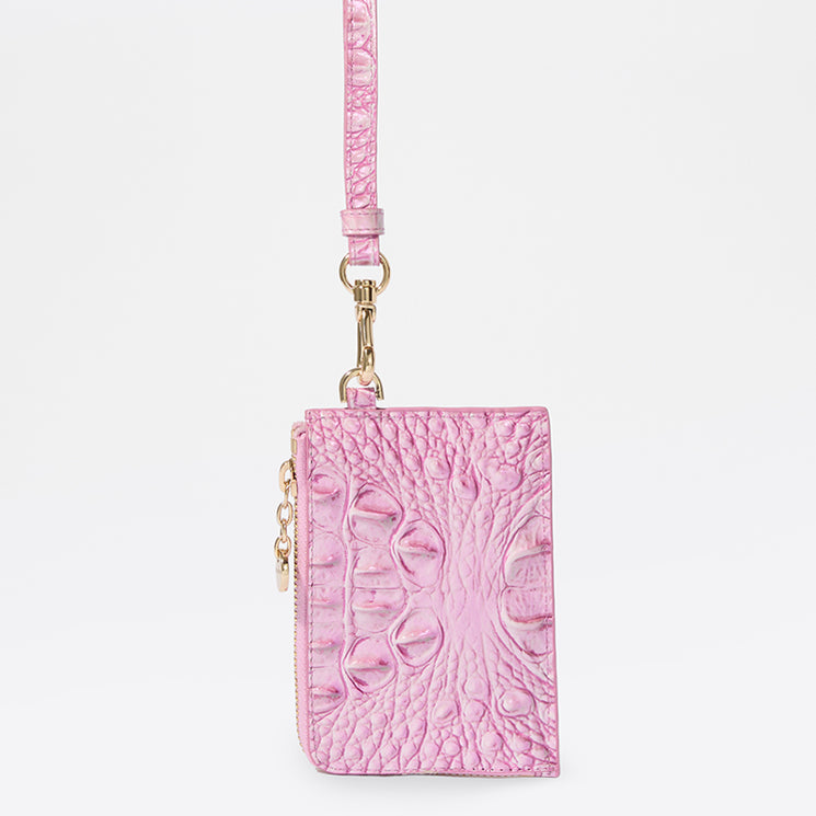 Brahmin pink wallet with embossed textured pattern, gold-tone hardware, and removable matching strap with clasp. Compact rectangular silhouette shown on a white background, front view; interior not visible.