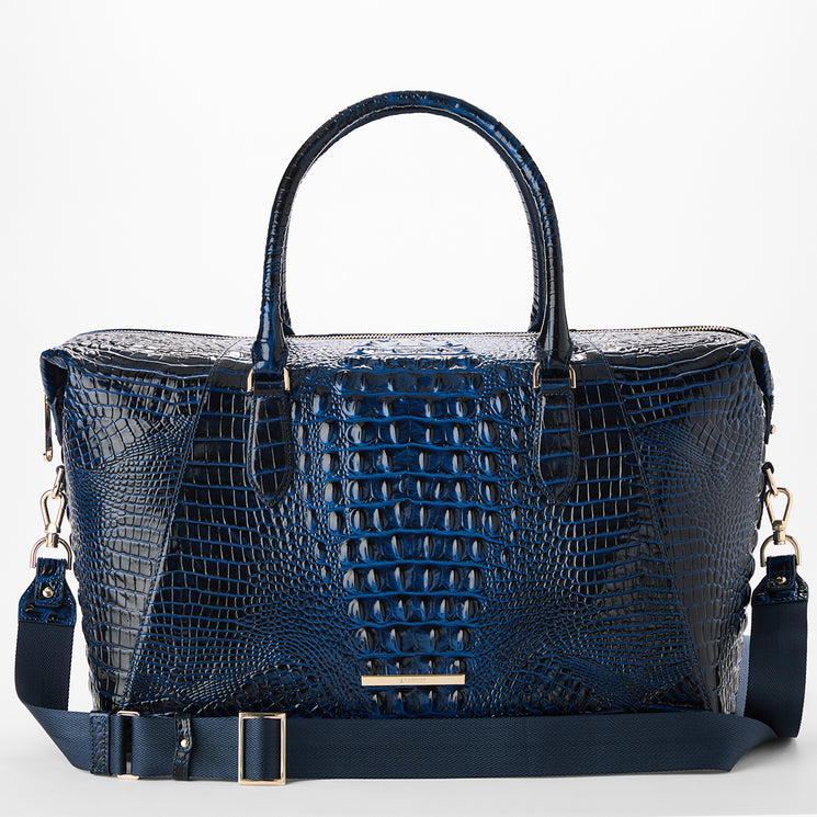 A navy blue crocodile-embossed leather handbag with dual top handles and a matching detachable shoulder strap, shown on a clean white background.