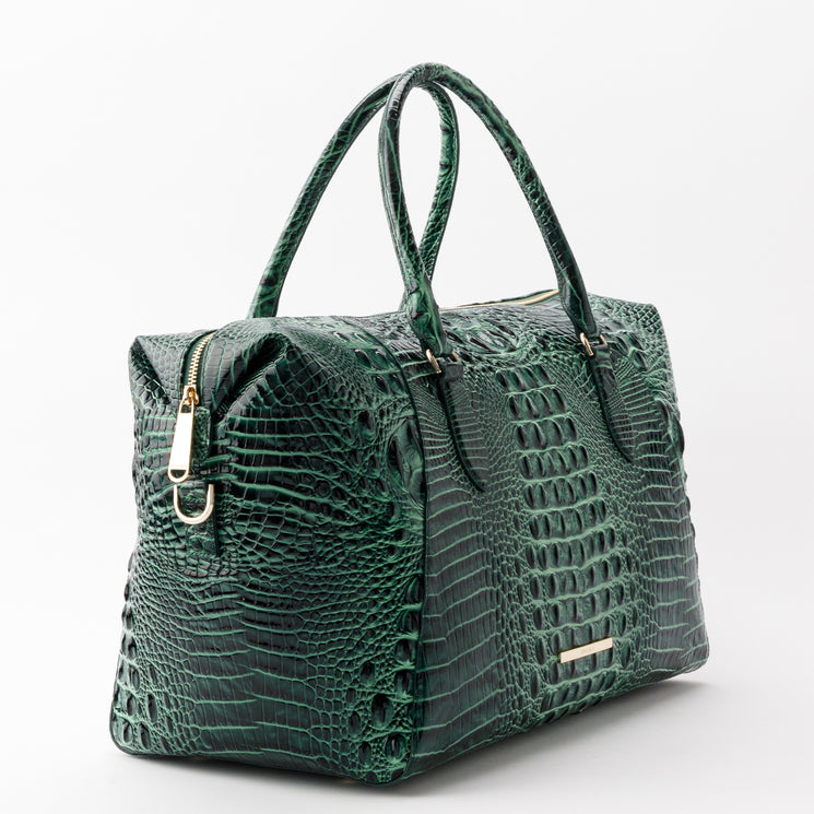 Dark green Brahmin Daniela satchel featuring a compact silhouette, dual handles, gold-tone hardware, and an embossed croc-patterned texture.