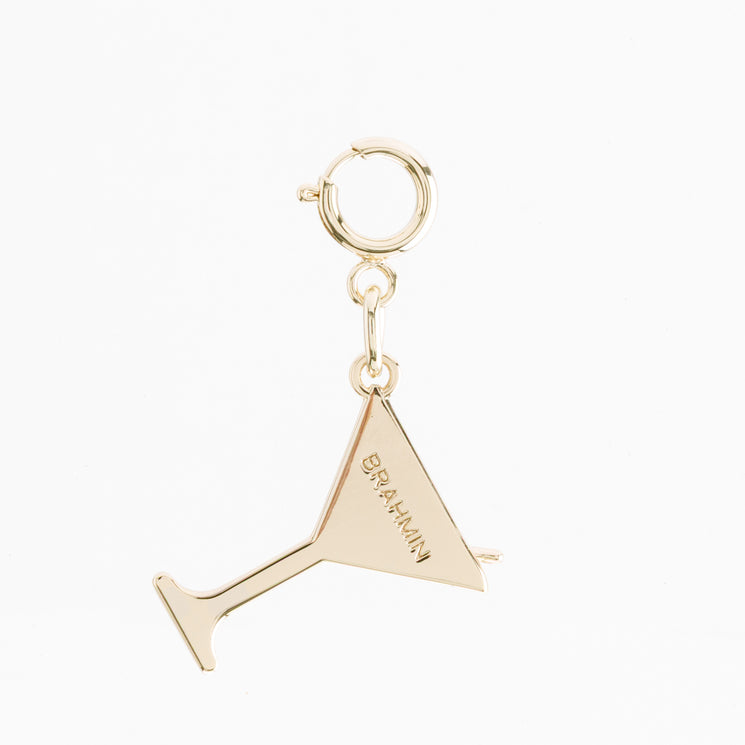 Gold-tone Small Martini bag charm shaped like a martini glass, featuring a circular spring ring clasp and the Brahmin brand name engraved on the side.
