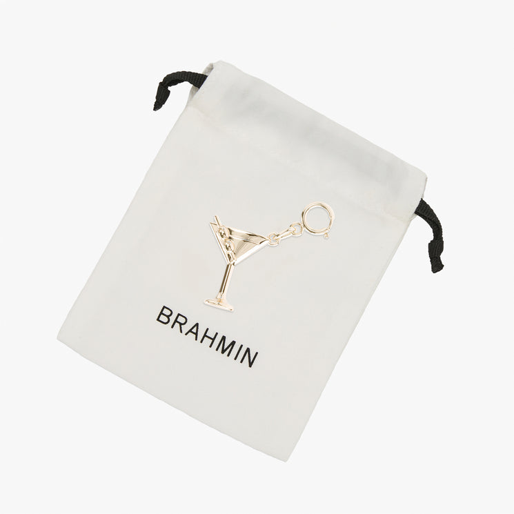 Small white Brahmin Martini drawstring pouch with a gold-tone martini glass charm and the BRAHMIN logo.