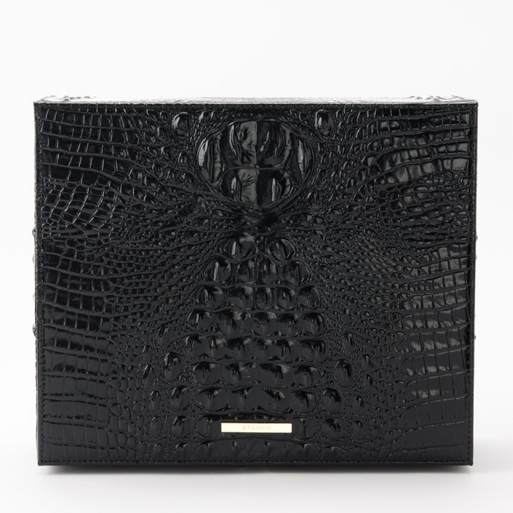 Brahmin Large Box bag in black with a glossy, embossed textured pattern, featuring a gold-tone brand logo plate on the front.
