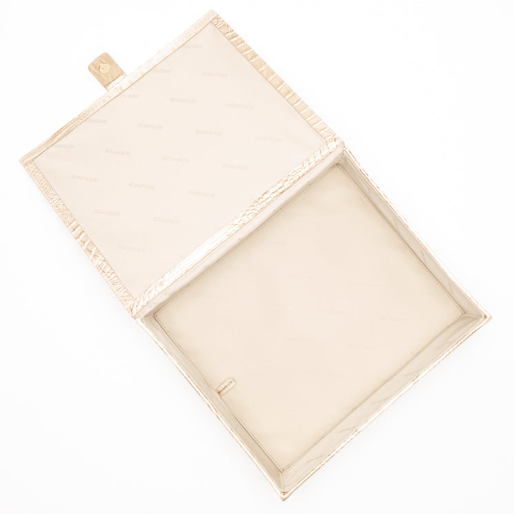 BRAHMIN Large Box clutch in beige and gold croc-embossed leather with snap closure, open and empty, top view showing structured interior, rectangular shape, and textured finish against a white background.