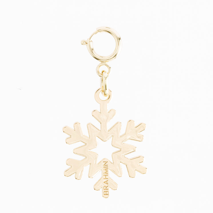 BRAHMIN small snowflake charm in gold-tone metal with a circular spring ring clasp and Brahmin brand name engraved on one point.