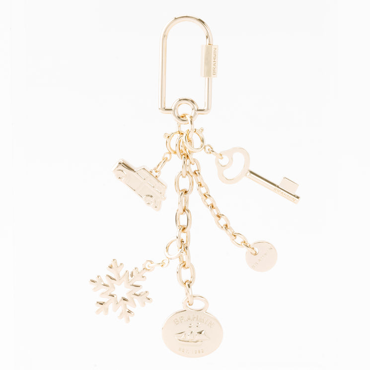 Gold-tone BRAHMIN small snowflake keyring featuring a carabiner clip with snowflake, car, key, and branded disc charms.