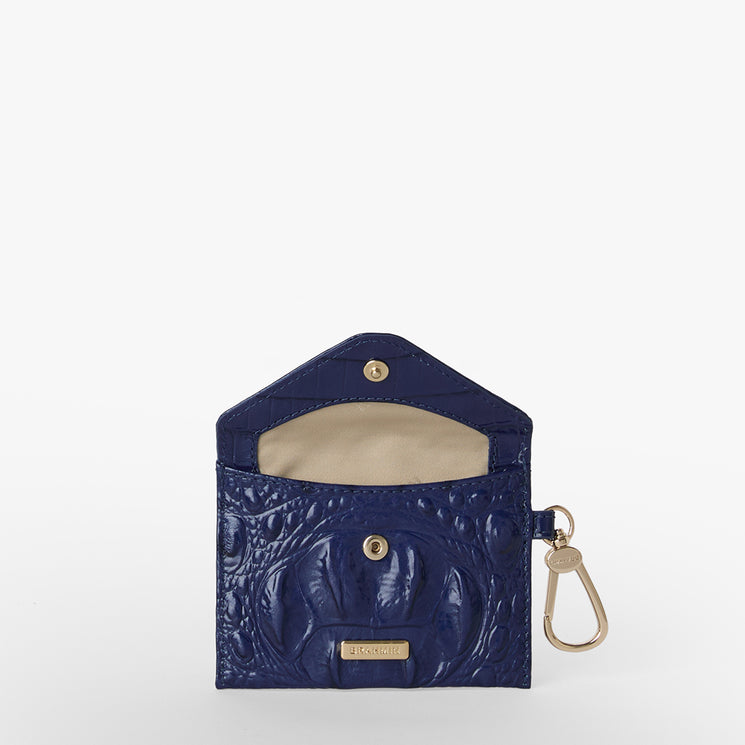 BRAHMIN Lana small coin purse in midnight blue croc-embossed leather with a gold snap button, beige interior, and gold keychain clip-on pouch, shown open on a white background.