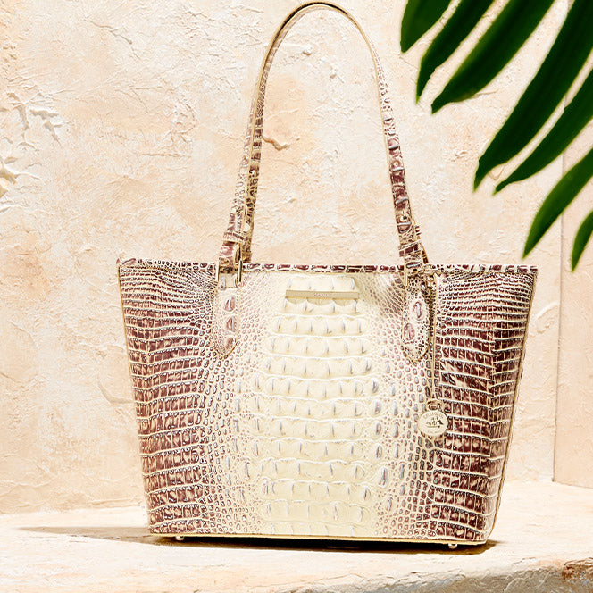 Brahmin ivory and brown croc embossed leather tote handbag with long shoulder straps, gold hardware, and signature medallion charm