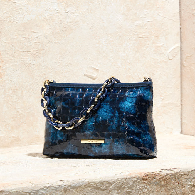 Brahmin navy blue croc embossed leather shoulder bag with glossy finish, chunky chain strap, and gold logo hardware