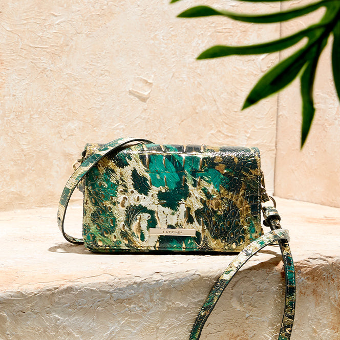 Brahmin green, ivory, black, and gold croc embossed leather crossbody bag with slim strap and gold logo hardware